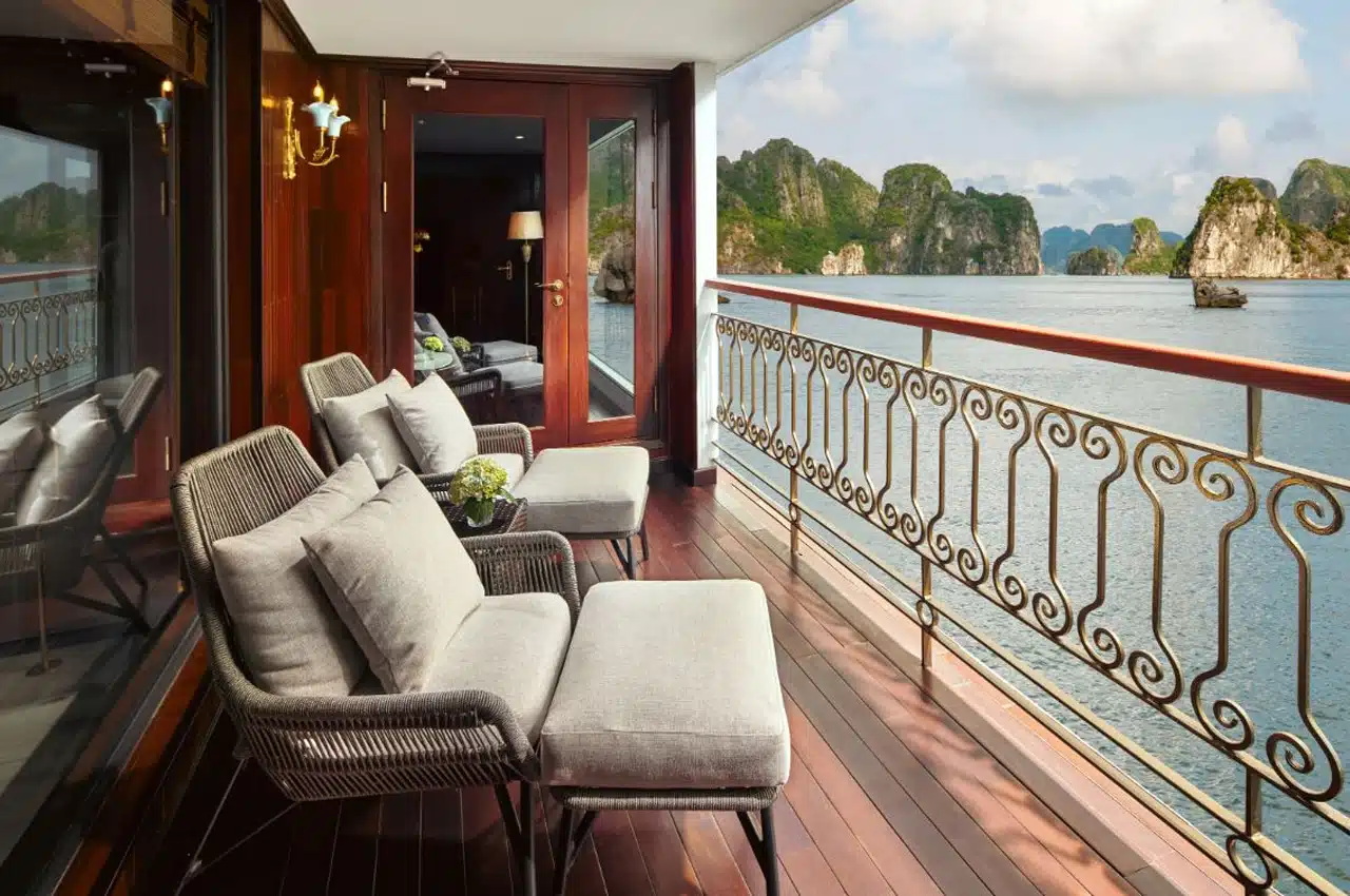 Private balcony suite on a 5-star Halong Bay cruise overlooking the limestone islands.